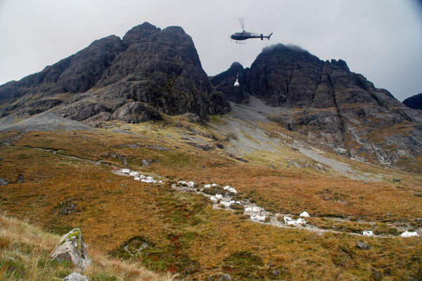 Helicopter brining materials to Bla Bheinn path
