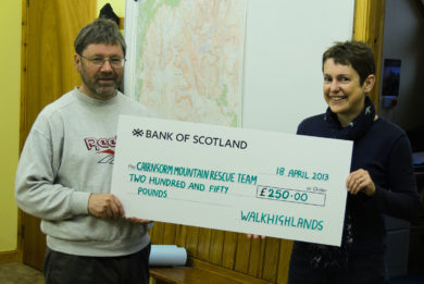CMRT leader Willie Anderson receiving a cheque from Walkhighlands' Helen Webster