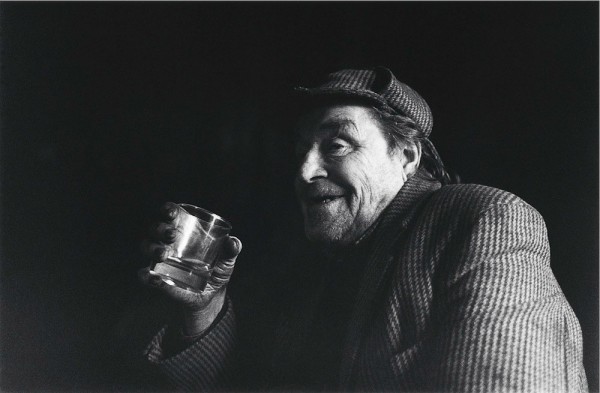 I love this photo of Donnie. I took it at his home in Cashlie, the last inhabited house as you drive west through Glen Lyon. It was late afternoon and there wasn’t really any light inside his living room apart from the flicker of the open fire. So I had to rely on the fading light from the window behind him and a good deal of luck. Of all the shots I took of him this was the only one that was sharp enough because I had to knock the shutter down to 1/30th of register capture the play of light across his face. Donnie was in reflective mood that day and like many other residents in Glen Lyon is a very private man. So I had to take pictures quickly and without any fuss to keep the conversation (and whisky) flowing. He was the stalker in Glen Lyon until he retired and was telling me about all the hills he had walked when I took this shot. It is a very natural portrait, set in the darkness of a long Highland winter.